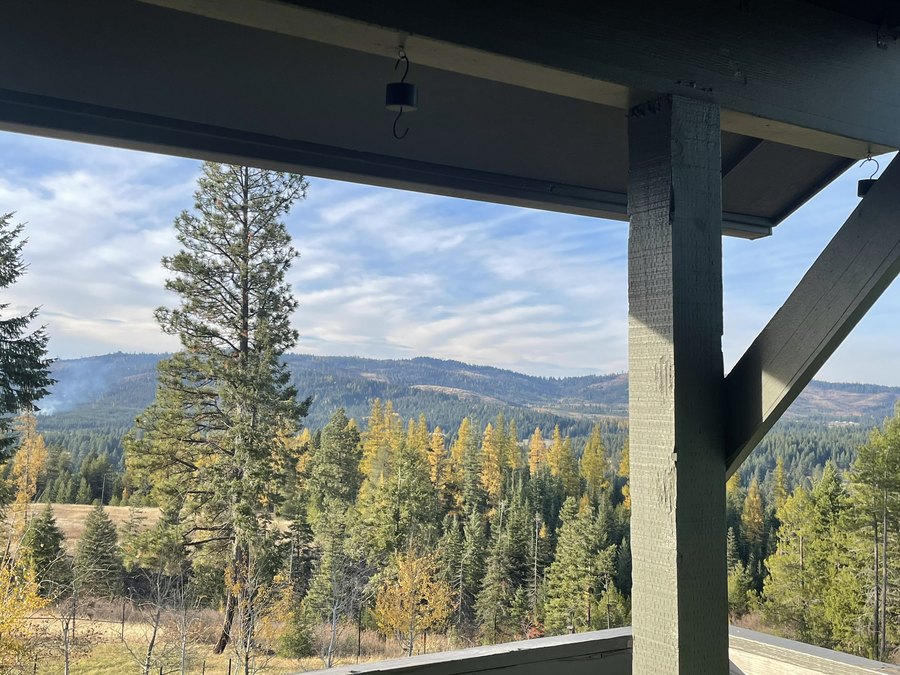 Rear porch view in fall, color across the ridgeline
